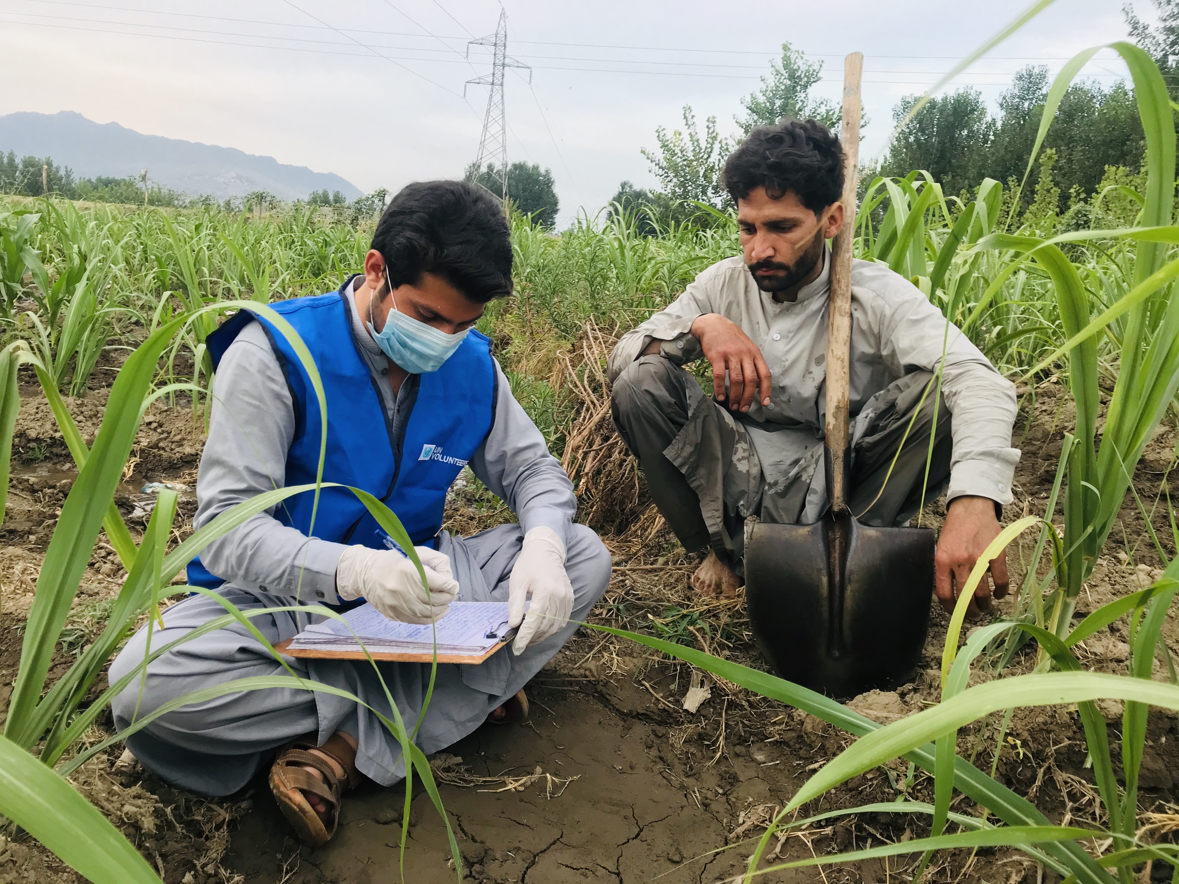 Fawad Arshad (left), former national University UN Volunteer, served with UNDP in Pakistan to promote civic and voter education in rural communities to strengthen the engagement of citizens, particularly women and youth, in electoral processes. (UNV, 2020)
